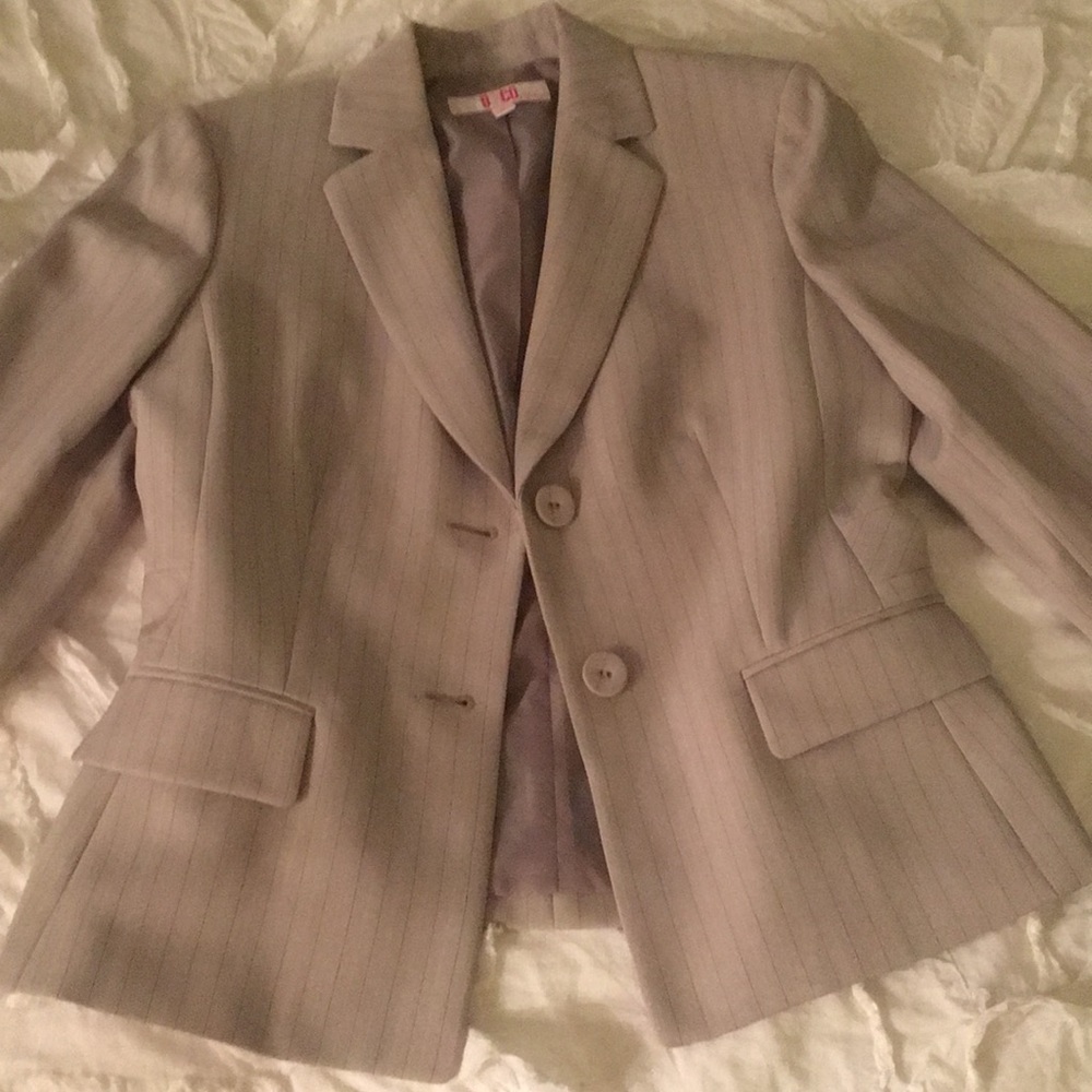 Woman’s two piece suit jacket and skirt pinstriped